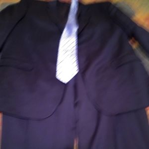 A 54L 2 Button Navy Blue Jos.A.Bank Suit 46 waist 32/34 Length. Flat front.
